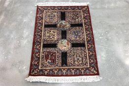A SMALL PAK PERSIAN WOOL RUG (97 x 65cm)
