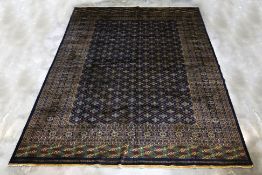 A KASHMIRI WOOL CARPET (365 x 283cm)