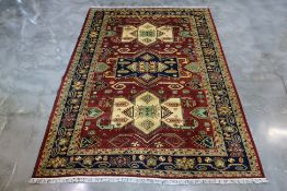 A TURKMEN WOOL CARPET (296 x 205cm)