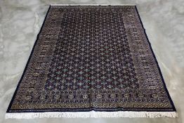 A KASHMIRI WOOL CARPET (307 x 250cm)