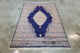 A KASHMIRI SILK AND WOOL CARPET (278 x 185cm)