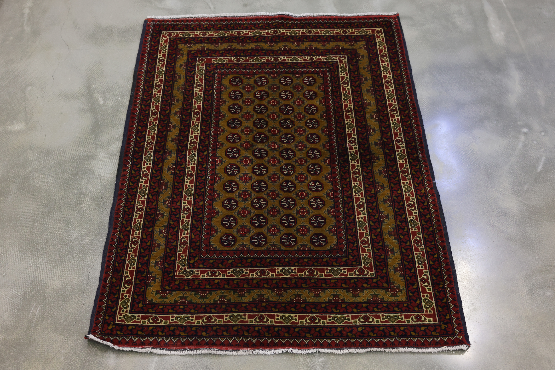 A KHAWAJA ROSHNI BOKHARA WOOL RUG (150 x 116 cm)