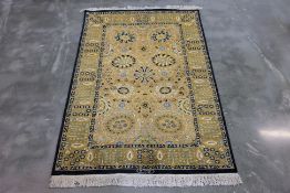 A PERSIAN WOOL RUG (196 x 126cm)