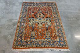 AN ANTIQUE TABRIZ WOOL RUG (220 x 162cm)