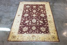 AN AFGHAN WOOL RUG (263 x 180cm)