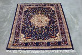 A SAROUK WOOL RUG (176 x 156cm)