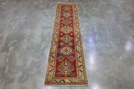 A KAZAK WOOL RUNNER (324 x 83cm)