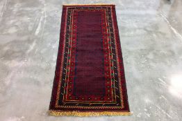 A PERSIAN WOOL RUNNER (188 x 83cm)