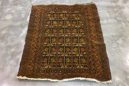 AN ANTIQUE PERSIAN FILPA WOOL RUG (154 x 123cm)