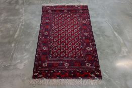 A BOKHARA WOOL RUG (195 x 107cm)