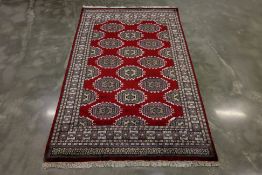 A KASHMIRI SILK AND WOOL RUG (250 x 154)