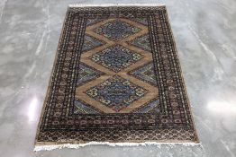 A KASHMIRI SILK AND WOOL RUG (207 x 140cm)