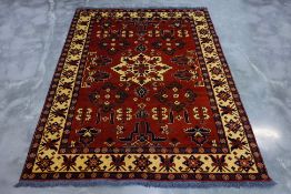 A TURKMEN WOOL RUG (276 x 209cm)