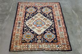 AN UCHAN WOOL RUG (165 x 140cm)