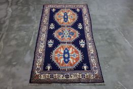 A CAUCASIAN SHIRWAN WOOL RUG (225 x 120cm)