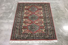 A KASHMIRI WOOL RUG (160 x 127cm)