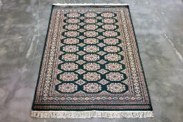 A KASHMIR WOOL AND SILK RUG (185 x 127cm)
