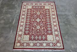 A PERSIAN MASHAD SILK AND WOOL RUG (189 x 124cm)
