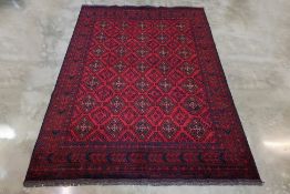 A TURKMAN WOOL RUG (288 x 210cm)