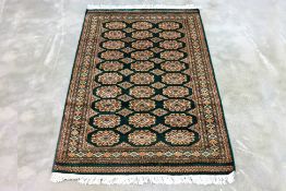 A KASHMIRI SILK AND WOOL RUG (188 x 125cm)