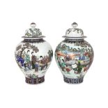 A PAIR OF FAMILLE ROSE PORCELAIN JARS WITH COVERS
