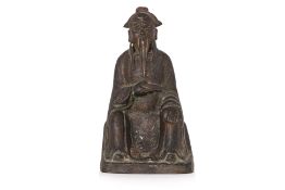 A PARCEL GILT SEATED BRONZE FIGURE OF GUANDI
