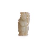 A CARVED CELADON JADE FIGURE
