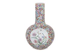 A LARGE FAMILLE ROSE 'MILLEFLEURS' TIANQIUPING BOTTLE VASE
