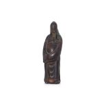 A STANDING BRONZE FIGURE OF A GUANDI