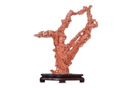 A LARGE CORAL CARVING OF THREE GUANYIN