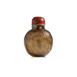 A CARVED SMOKY QUARTZ SNUFF BOTTLE