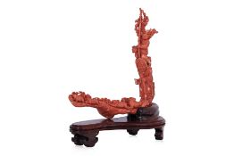 A CORAL CARVING OF A FARMER AND BOY WITH GOATS