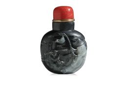 A BLACK AND WHITE JADE 'FISHERMAN' SNUFF BOTTLE