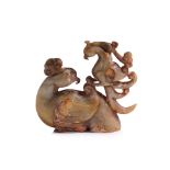 A CELADON AND RUSSET JADE CARVED MODEL OF TWO PHOENIX