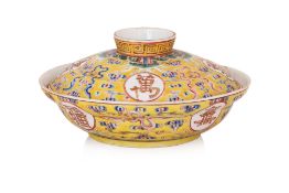 A YELLOW GROUND FAMILLE ROSE PORCELAIN BOWL AND COVER