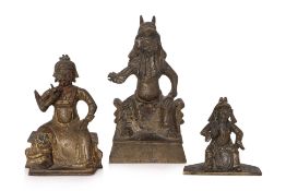 A GROUP OF THREE BRONZE FIGURES OF GUANDI