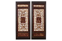 A PAIR OF CARVED AND PAINTED HARDWOOD DOOR PANELS