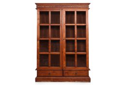 A GLAZED TEAK BOOKCASE