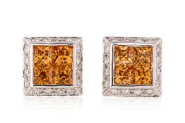A PAIR OF CITRINE AND DIAMOND STUD EARRINGS