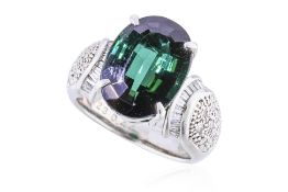 A GREEN TOURMALINE AND DIAMOND RING