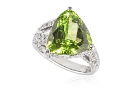 A PERIDOT AND DIAMOND RING