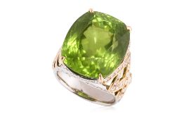 A LARGE PERIDOT AND DIAMOND TWO-TONE RING