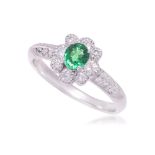 A TSAVORITE GARNET AND DIAMOND RING