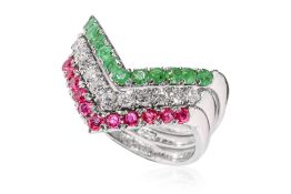 A SET OF DIAMOND, RUBY AND EMERALD STACKING RINGS