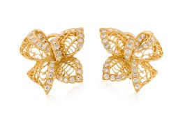 A PAIR OF 'FILLIGREE RIBBON' DIAMOND EARRINGS