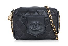 CHANEL - A VINTAGE BLACK CALFSKIN CAMERA BAG