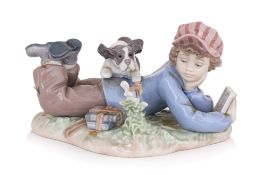A LLADRO PORCELAIN MODEL OF A BOY AND DOG