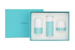 A THREE PIECE SET OF TIFFANY & CO MINI FLOWER VASES