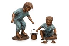 A LARGE BRONZE SCULPTURE OF TWO BOYS CATCHING FROGS