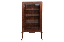 A CONTINENTAL EUROPEAN WALNUT GLAZED DISPLAY CABINET
